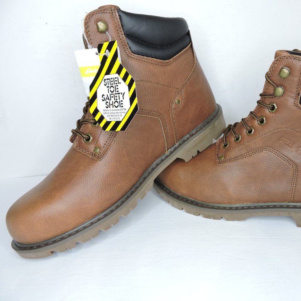 Brand new Eddie Bauer work boots with Steele toe, oil resistant tread, metal eye